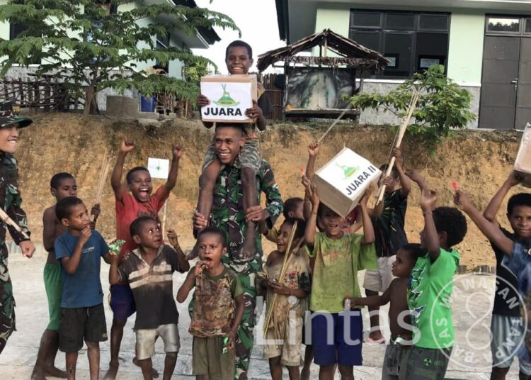 Lestarikan Budaya, Satgas Yonif 310/KK Gelar Lomba Jubi Untuk Anak-Anak Papua