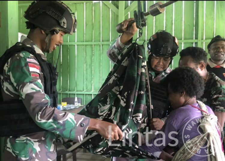 Bersinergi Tingkatkan Kualitas Kesehatan di Perbatasan, Satgas Yonif 310/KK Gelar Posyandu