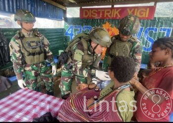 Satgas TNI Bangkitkan Semangat Anak-Anak Yigi Dalam Peringatan Hari Anak Nasional