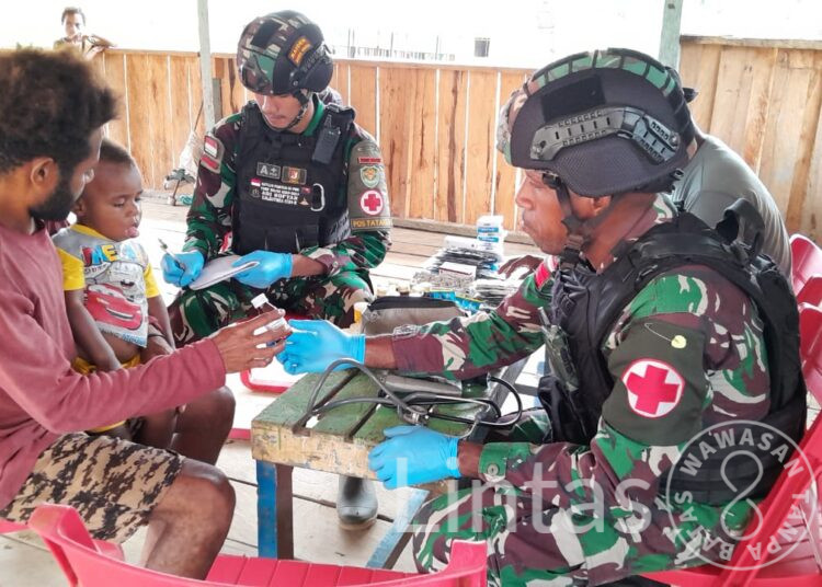 Bakti Kesehatan, Satgas Yonif 310/KK Gelar Posyandu di Perbatasan