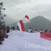 Kirab Dan Pengibaran Bendera Merah Putih Raksasa Bukti Kedaulatan NKRI di Distrik Sinak